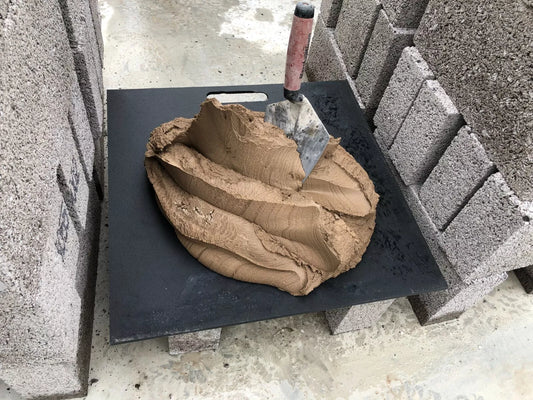 Durable & portable plastic spot board for builders, also known as a mortar board, allows positioning of mortar or cement within quick and easy reach